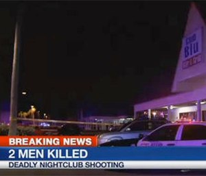 A crowd gathers near the scene of the fatal shooting at Club Blu in Fort Myers, Fla (AP Photos/WBBH)