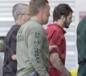 Esteban Santiago, right, accused of fatally shooting several people and wounding multiple others at a crowded Florida airport baggage claim, is returned to Broward County's main jail after his first court appearance, Monday, Jan. 9, 2017, in Fort Lauderdale, Fla.