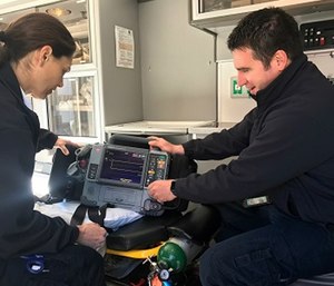 Ada County Paramedics Field Training Officer, Justin Raney, goes over equipment with EMT B MK Welch.