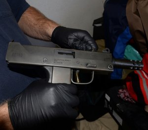 This Thursday, Dec. 7, 2017, photo shows a MPA 9mm gun, one of the 35 seized weapons during a gang crackdown in Stockton, Calif.