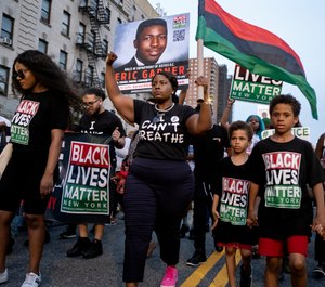 Protesters with Black Lives Matter protest in the Harlem neighborhood of New York, Tuesday, July 16, 2019. (AP Photo/Craig Ruttle)