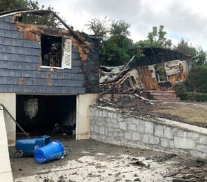The house owned by Lawrence Police Officer Ivan Soto sits nearly burned to the ground on Jefferson Street, in Lawrence, Mass., Friday, Sept. 14, 2018.