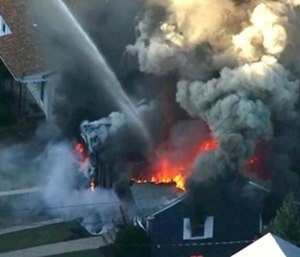 A series of gas explosions an official described as "Armageddon" killed a teenager, injured at least 10 other people and ignited fires in at least 39 homes. (Photo/AP)