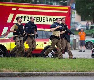 Policemen arrive at a shopping centre in which a shooting was reported in Munich. (AP Image)