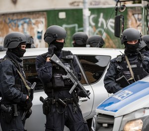 Police block access to a street near the scene of a shooting that has left two people dead on October 9, 2019 in Halle, Germany.