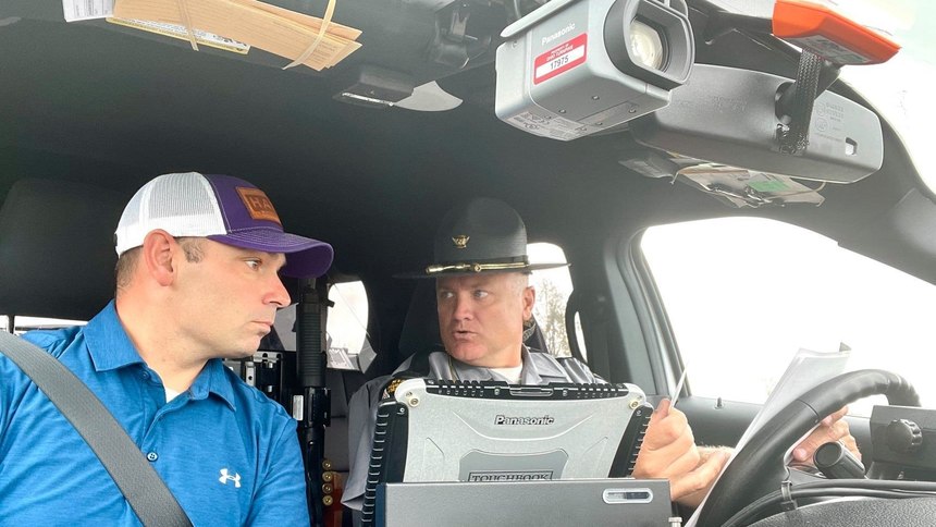Ohio State Rep. Haraz N. Ghanbari sits in a patrol car during a ride-along with Ohio State Highway Patrol Trooper Casimir Von Sacken.