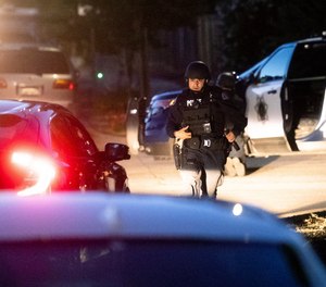 Police work a scene after a deadly shooting at the Gilroy Garlic Festival in Gilroy, Calif., Sunday, July 28, 2019.