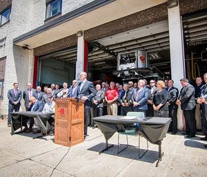 Gov. Charlie Baker signed a bill into law that covers medical treatment and time missed due to illness for all firefighters diagnosed with cancer. (Photo/Gov. Charlie Baker's Office)