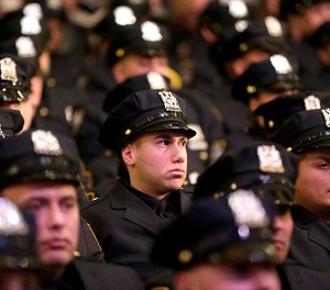 New police officers attend their graduation ceremony at the Beacon Theatre in New York, Thursday, Dec. 28, 2017.