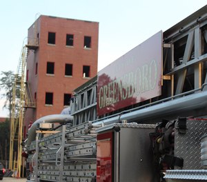 The Greensboro Fire Department's five-story drill tower, built in 1956, was set to be demolished on Saturday. Retired firefighters will be allowed to retrieve a brick from the tower after the demolition. (Photo/Greensboro Fire Department Facebook)