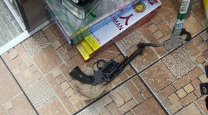 This image shows the gun recovered from a shooting that left one person dead at a Queens deli on October 26, 2020.