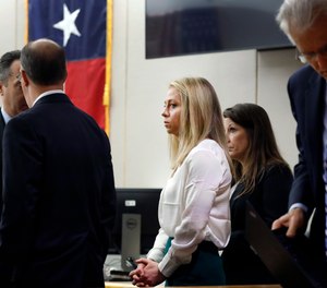 Former Dallas police officer Amber Guyger, center, appears in court on Saturday, September 28. (Photo/AP)