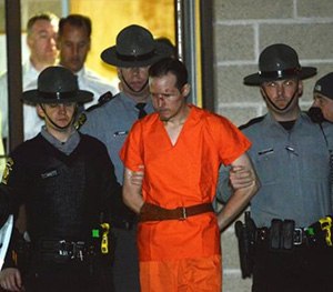 State troopers escort Eric Matthew Frein from the Blooming Grove barracks early Friday.