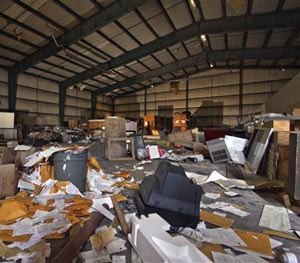 Debris is strewn about the main room inside the airport hangar on abandoned Birchwood Resort grounds in Pocono Township, Pa., Tuesday, Nov. 4, 2014, where where accused Pennsylvania State Trooper killer Eric Frein was arrested last Thursday.
