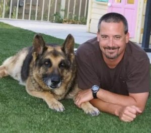 This undated photo shows Sgt. Harry Cohen with a police K-9.