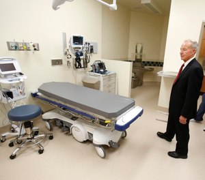 In this June 25, 2013 file photo, Jeffrey Beard, secretary of the California Department of Corrections and Rehabilitation, looks over an emergency care room while touring the California Correctional Health Care Facility in Stockton, Calif.