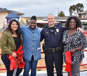 Deputy chief Nick Borges is pictured with residents from the Del Monte Manor in Seaside, California.