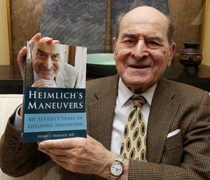 Dr. Henry Heimlich holds his memoir prior to being interviewed at his home in Cincinnati.