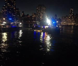 A helicopter has crashed into New York City's East River. (Photo/AP)