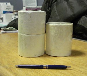 This April 1, 2015 photo provided by U.S. Customs and Border Protection shows cylinders of heroin weighing approximately two pounds.