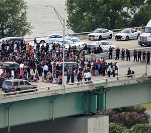 Black Lives Matter protesters gather on the Hernando Desoto Bridge in Memphis, Tenn., Sunday, July 10, 2016.