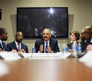 U.S. Attorney General Eric Holder, center, meets with law enforcement and community leaders for a roundtable discussion at Ebenezer Baptist Church, Monday, Dec. 1, 2014, in Atlanta.
