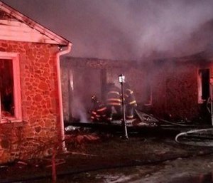 A mayday call went out Monday after an assistant chief fell through the floor of a burning home while searching for occupants.