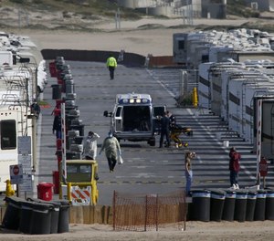 More than 100 RVs are parked at Dockweiler State Beach in Los Angeles to house people who have tested positive or have symptoms of COVID-19. Many of the patients are homeless.