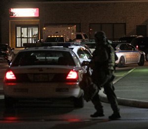 Police are shown working at the scene of an emergency at Tomball Regional Medical Center Saturday, Jan. 10, 2015, in Tomball, Texas.