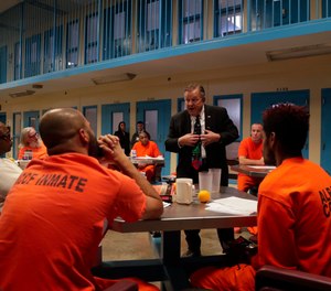 Soldier On president John Downing talks with inmates inside the veteran's pod at the Albany County Correctional Facility, Monday, Nov. 27, 2017, in Albany, N.Y.