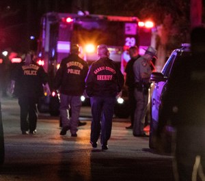 Houston police during a deadly drug raid that left 2 fatally shot and 5 officers injured (Photo/ AP)