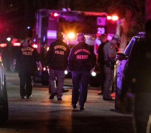 Police investigate the scene where several Houston Police officers were shot in Houston on Monday, Jan. 28, 2019. At least five Houston officers were injured in a shooting Monday in an incident involving a suspect and taken to a hospital, police said. (Brett Coomer/Houston Chronicle via AP)