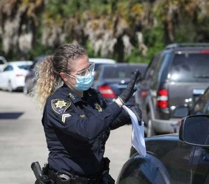 Police officers and deputies in Harris County will provide masks to individuals not wearing one in public per a judge's order.