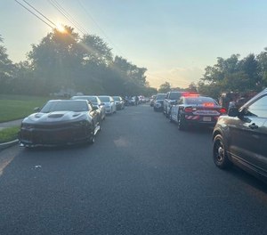 Police arrive at a New Jersey mansion to shut down a pool party attended by 300 people August 9, 2020.
