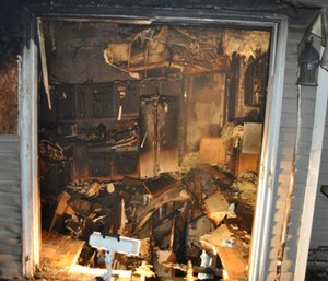 The firefighter died in a floor collapse while he was working above a residential basement fire. (Photo/NIOSH)