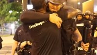 Hope amidst the riots: How a hug between a cop and an activist sparked a movement