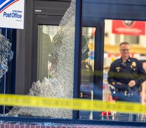 A police officer and civilian took down a man who entered a crowded supermarket after firing shots at vehicles outside.