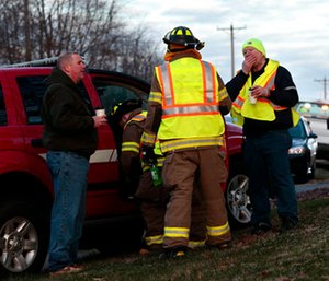 Firefighters and other emergency workers at the scene near Silver Lake, where a submerged SUV was found with a baby inside in Highland, Ill.