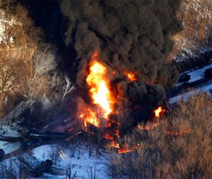 Smoke and flames erupt from the scene of a train derailment near Galena, Ill.