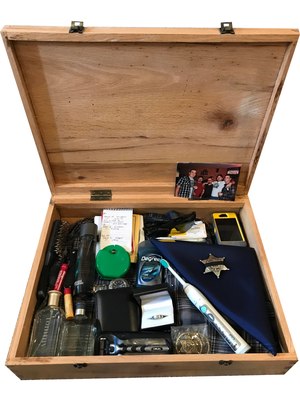 These are the items Sarah Deatherage Steele keeps in Trooper Kyle Deatherage's box. Items such as his shirt that I loved on him, photos, phone, toothbrush, wedding ring, cologne, badge, handwriting, hairbrush, razor, lip balm, sunglasses and more. (Photo/ComfortingKeepsakes)