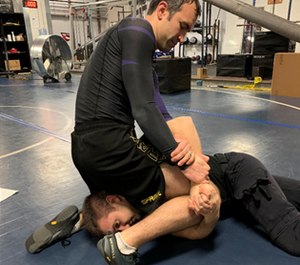 The training partner provides a variable on this repetition by gripping his hands together as part of a random (interleaved) practice session.