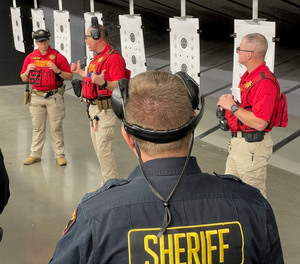 Briefing: (L-R in red) Deputy Lorenzatti, Rangemaster Weidner, Deputy Marcussen.