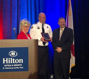 Joshua Hoover was honored for his actions after performing life-saving skills on a young girl who had been pulled from the water at a water park.
