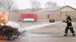 FR1 Editor-in-Chief Rick Markley takes on the car-fire prop at Hennepin Technical College.
