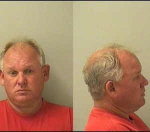 A judge released Guy M. Landmeier on his own recognizance and ordered him to surrender all badges and other items identifying him as a firefighter.