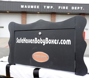 This photo shows a prototype Safe Haven baby box outside a fire station in Woodburn, Ind. in 2015. More Indiana communities are working to fund the installation of baby boxes after a newborn was safely surrendered at a fire station in Clarksville earlier this month.