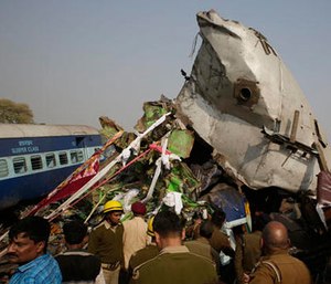 Rescuers work on the site of a train derailment accident in Kanpur Dehat, India, Sunday, Nov. 20, 2016.