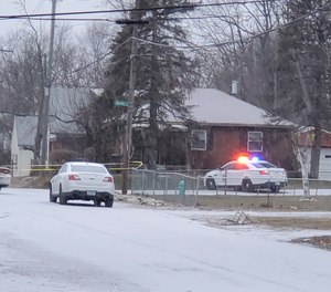 Indianapolis Metropolitan Police Department work the scene Sunday, Jan. 24, 2021 in Indianapolis where five people, including a pregnant woman, were shot to death early Sunday inside an Indianapolis home. (Justin L. Mack/The Indianapolis Star via AP)