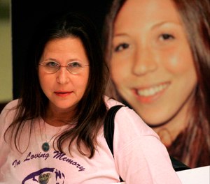 Margie Weiss, mother of Rachel Hoffman, shown in photo at right, waits for a news conference to start after the House of Representatives passed the confidential informants bill, Monday, April 27, 2009, in Tallahassee, Fla.