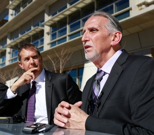 Craig Coley, right, accompanied by his attorney's Ron Kaye, center, and Nick Brustin, left, talks with reporters in Sacramento, Calif. Coley spent 39 years in prison for a murder he didn't commit.